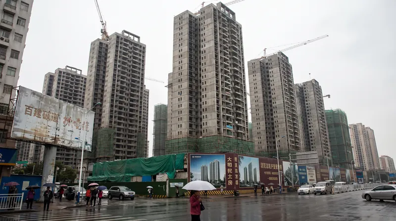 A modern high-rise residential complex in Shenzhen, China, representing the real estate market.
