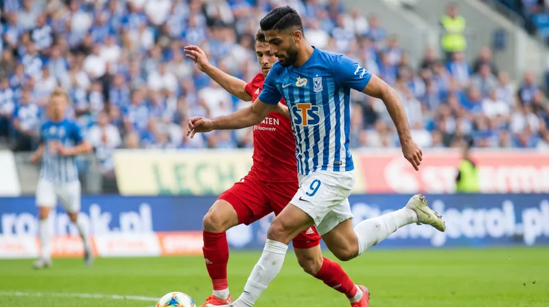 Allahyar Sayyadmanesh running on the football pitch wearing the blue and white jersey of Lech Poznan.